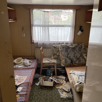 an abandoned boat repair shop with a police boat