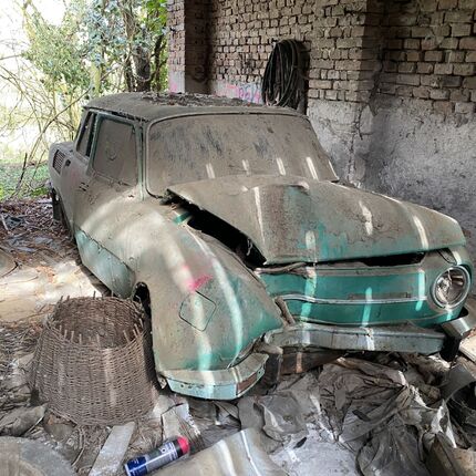 Abandoned farmhouses side by side.