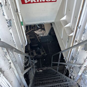 an abandoned boat repair shop with a police boat