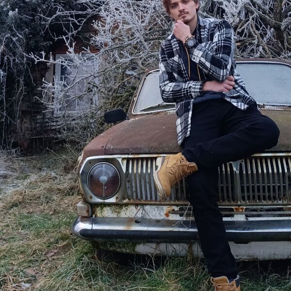 House with old Volga and big cross ✟