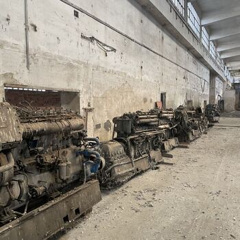 an abandoned boat repair shop with a police boat