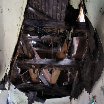 An abandoned house in the middle of a village