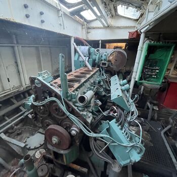an abandoned boat repair shop with a police boat