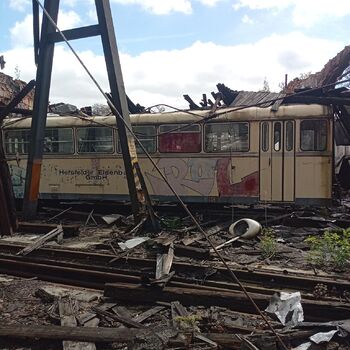 The depot with a collapsed roof and a slowly crumbling station building.2024 The depot with a collapsed roof and a slowly crumbling station building.2024